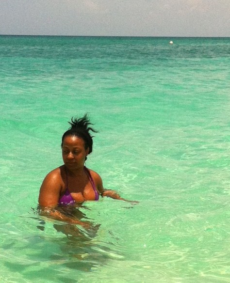 Lady enjoying Seven Mile Beach